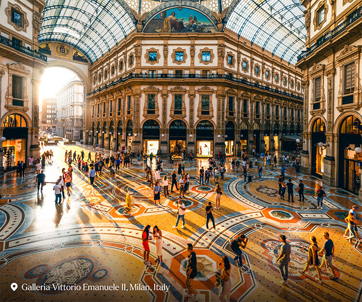 Crowd of people in Galleria Vittorio Emanuele II at sunset, Milan, Italy - stock photo